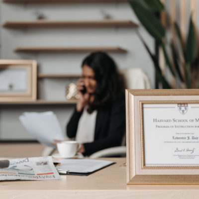 Medical license in frame on desk