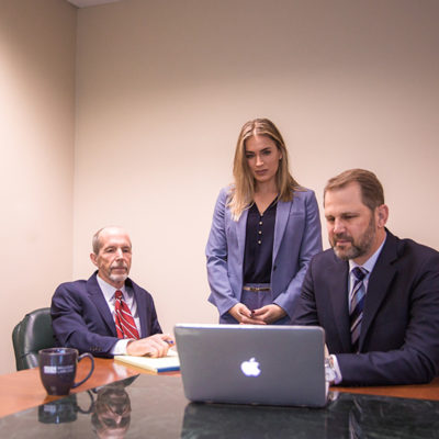 Attorneys looking at laptop screen