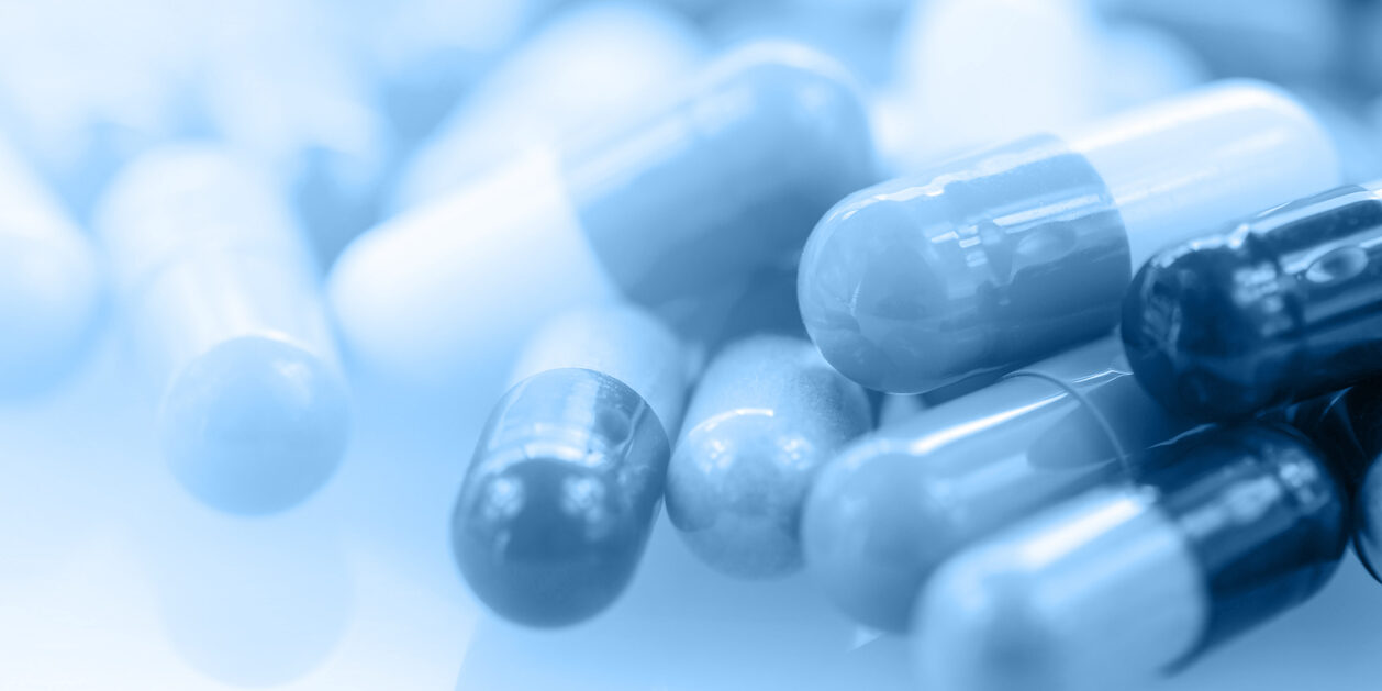 Oral medication background with warm light in blue tone.
