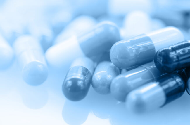 Oral medication background with warm light in blue tone.